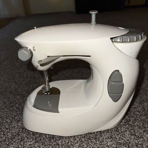 Small travel sewing machine